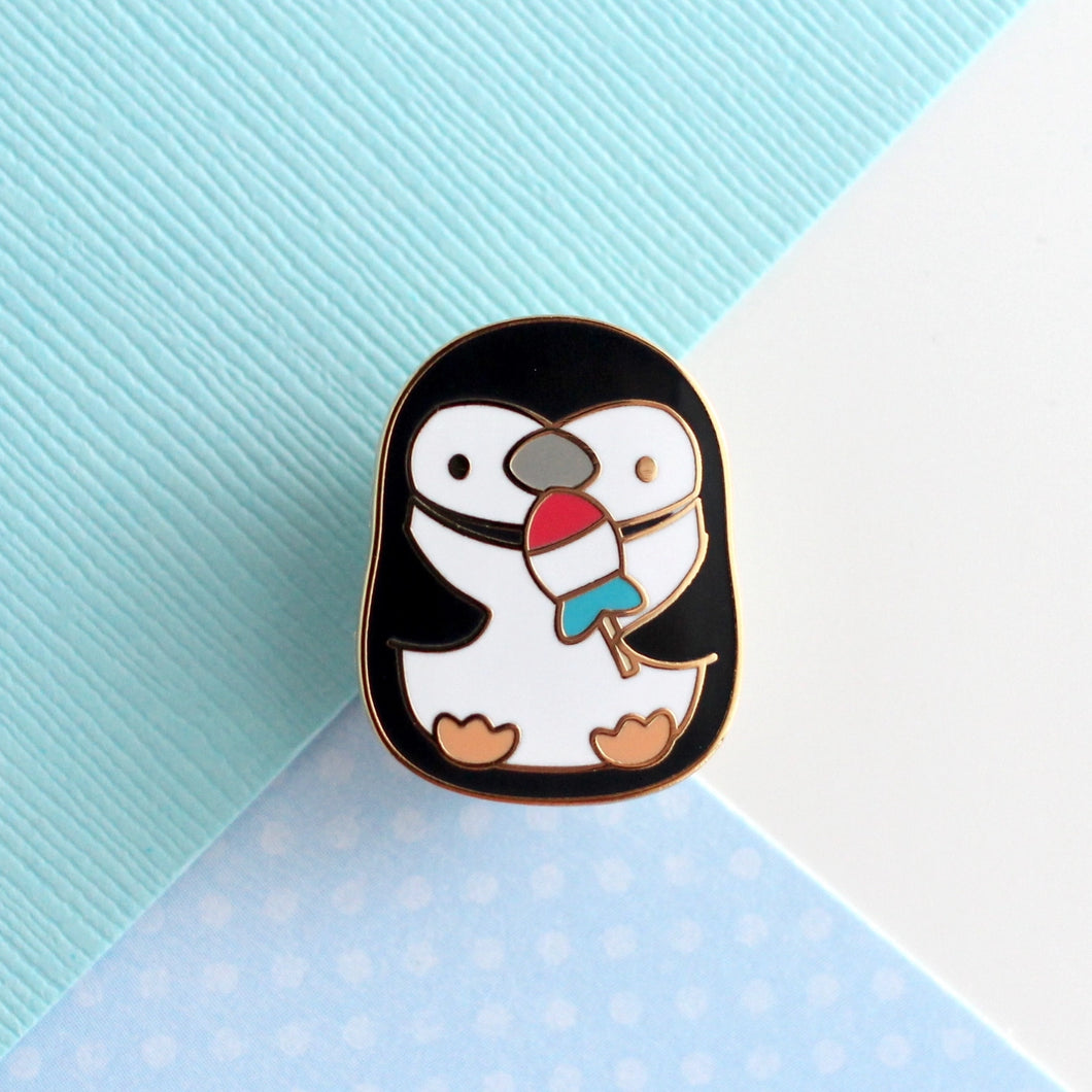 Penguin Holding Rocket Fish Ice Pop Enamel Pin